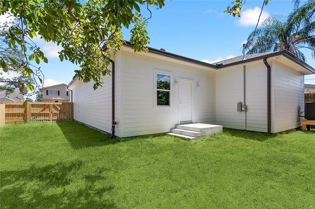 1504 Mason Smith Ave, Metairie, LA 70003 - back of house with a lawn and fence