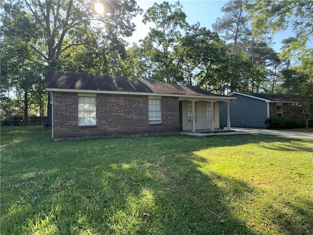 ranch-style home with brick siding and a front lawn
