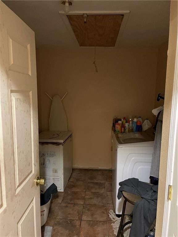laundry area with washer and dryer, tile patterned flooring, and laundry area