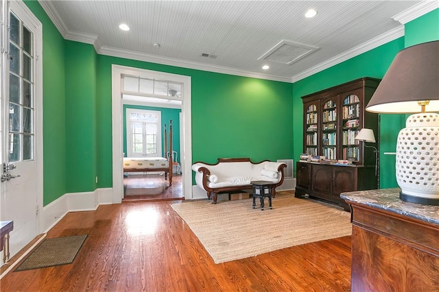 716 Governor Nicholls St Unit C, New Orleans, LA 70116 - sitting room with ornamental molding, wood finished floors, and recessed lighting