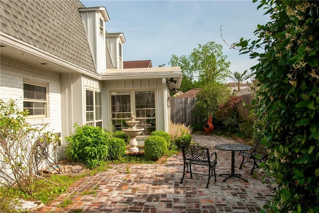 view of patio featuring fence