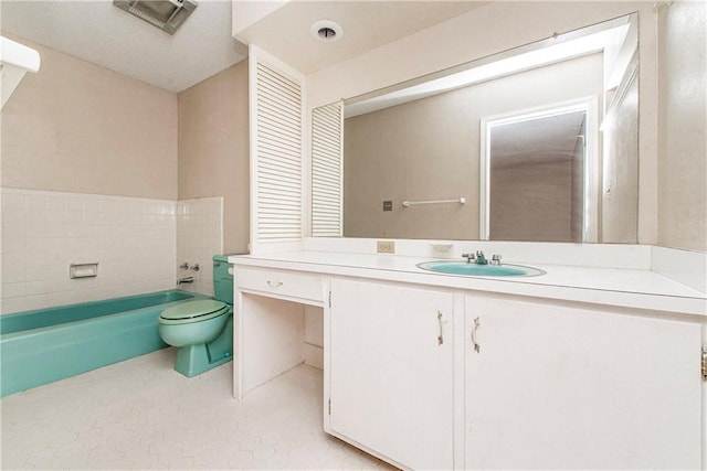 full bath featuring toilet, visible vents, a tub to relax in, and vanity