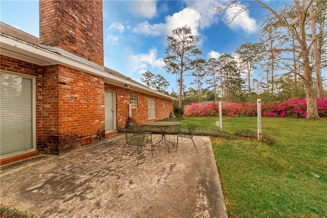 view of yard with a patio and outdoor dining area