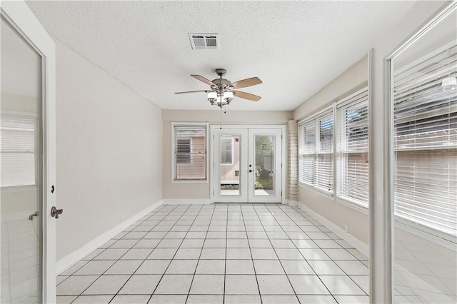 unfurnished sunroom featuring french doors and visible vents