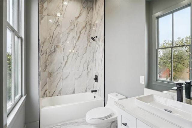 2613 Dauphine St, New Orleans, LA 70117 - full bathroom with vanity, a wealth of natural light, toilet, and shower / washtub combination