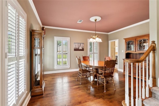 201 Laurel Ct, Luling, LA 70070 - dining space featuring baseboards, visible vents, wood-type flooring, and crown molding