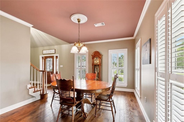 201 Laurel Ct, Luling, LA 70070 - dining room with dark wood-style floors, visible vents, crown molding, and baseboards