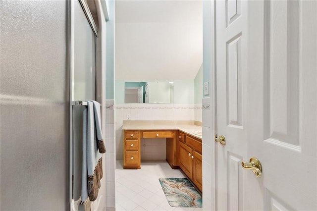 201 Laurel Ct, Luling, LA 70070 - bathroom with tile patterned floors, tile walls, and vanity