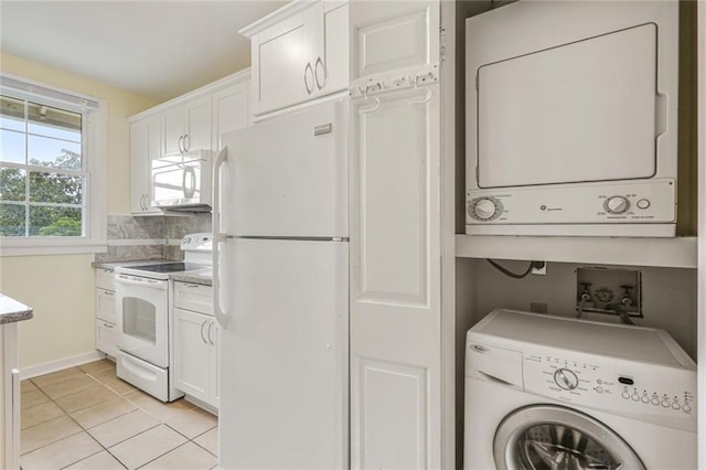 7444 St Charles Ave Unit 303, New Orleans, LA 70118 - laundry area with stacked washing machine and dryer and light tile patterned floors