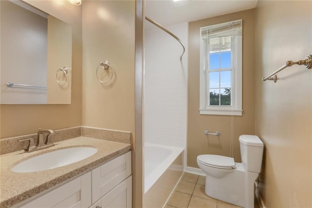 bathroom featuring tile patterned floors, vanity, toilet, and shower / washtub combination