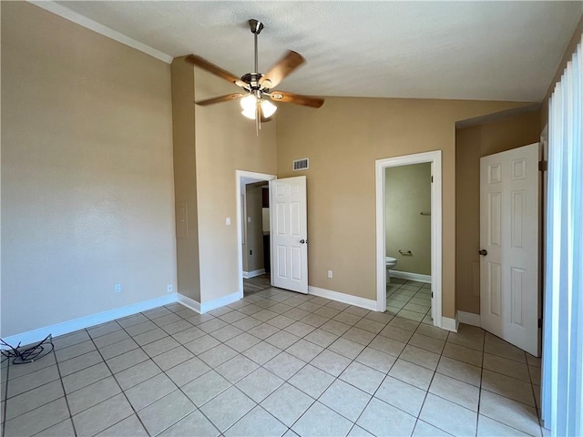 unfurnished bedroom featuring visible vents, ceiling fan, baseboards, light tile patterned flooring, and high vaulted ceiling