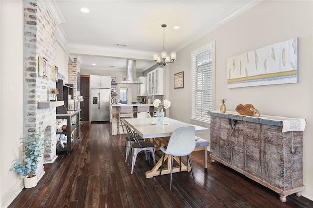 dining room featuring dark wood finished floors, visible vents, crown molding, and recessed lighting