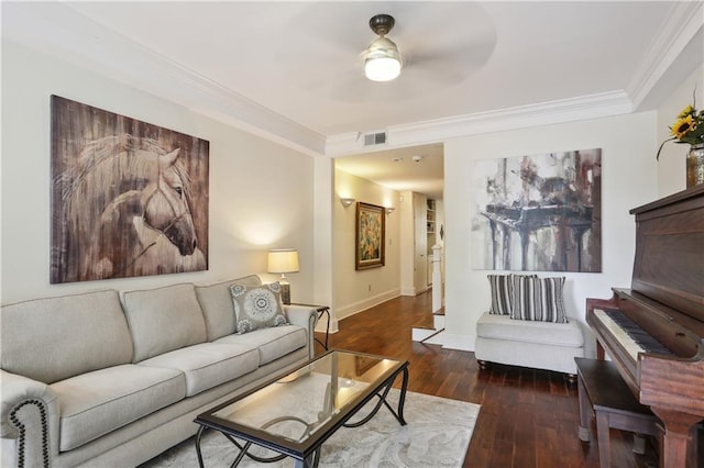 living area with crown molding, visible vents, ceiling fan, baseboards, and wood-type flooring
