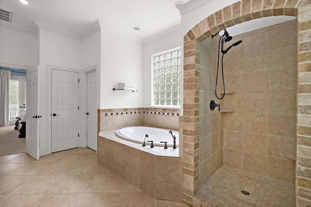 full bathroom with tile patterned flooring, ornamental molding, visible vents, tiled shower, and a bath