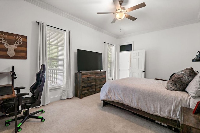 bedroom featuring ornamental molding, carpet, and ceiling fan