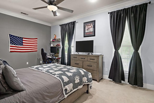 bedroom with crown molding, visible vents, baseboards, ceiling fan, and light colored carpet
