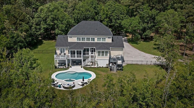 rear view of house featuring stairway, a deck, a yard, and a fenced backyard
