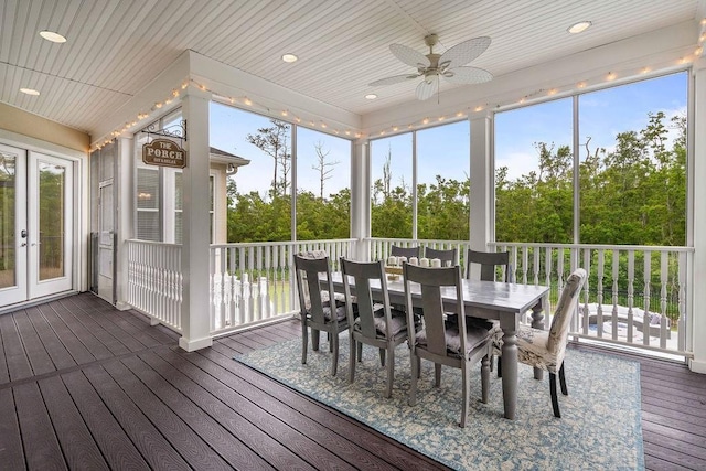 sunroom / solarium with a ceiling fan, outdoor dining area, and a wealth of natural light