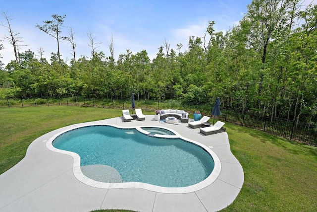 view of swimming pool featuring a lawn, outdoor lounge area, a fenced backyard, and a patio area
