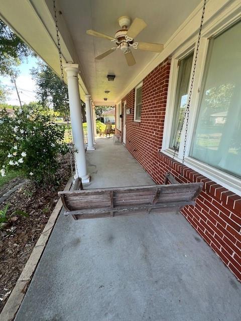 6735 W Magnolia Blvd, Harahan, LA 70123 - view of patio / terrace featuring a ceiling fan and a porch