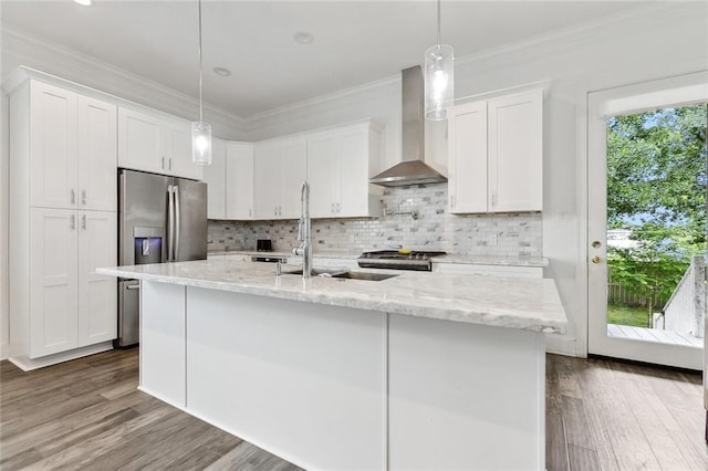 2321 Mehle St, Arabi, LA 70032 - kitchen with crown molding, wall chimney exhaust hood, a sink, and white cabinets