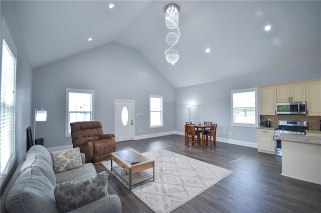 4132 Martin Luther King Jr Blvd, New Orleans, LA 70125 - living area with dark wood-style flooring, a healthy amount of sunlight, high vaulted ceiling, and baseboards