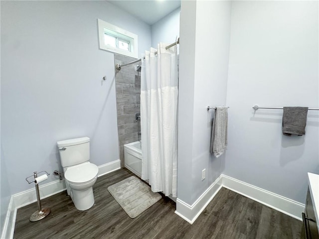 4132 Martin Luther King Jr Blvd, New Orleans, LA 70125 - full bathroom with baseboards, shower / bath combo, wood finished floors, and toilet