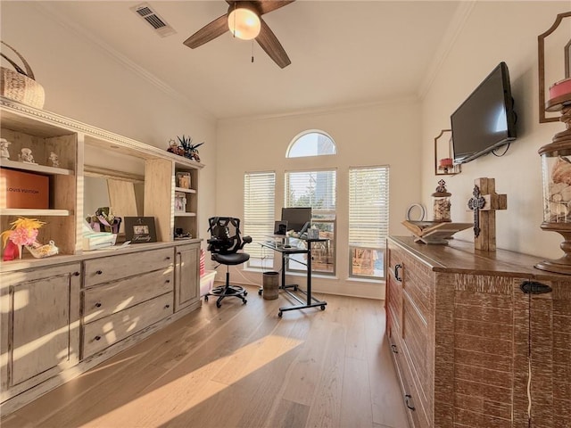 office area featuring visible vents, a ceiling fan, light wood finished floors, and crown molding