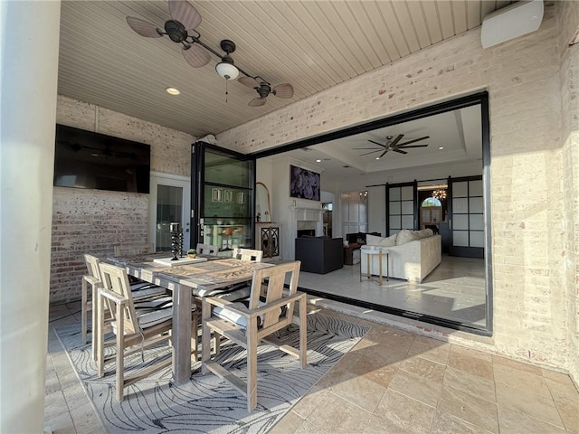 view of patio featuring outdoor dining space and a ceiling fan