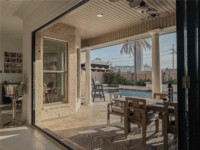 view of patio / terrace with fence, ceiling fan, outdoor dining area, and a fenced in pool