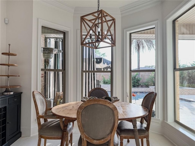 dining room with baseboards and ornamental molding
