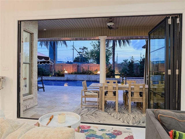 exterior space featuring a fenced in pool, outdoor dining space, and a fenced backyard