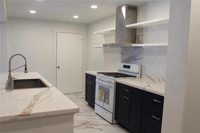 3024 Hero Dr, Gretna, LA 70053 - kitchen with open shelves, white gas stove, a sink, dark cabinetry, and island range hood