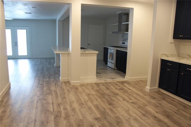 3024 Hero Dr, Gretna, LA 70053 - kitchen with electric range, range hood, light wood-style floors, baseboards, and dark cabinets