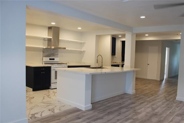 3024 Hero Dr, Gretna, LA 70053 - kitchen featuring white gas stove, a sink, ventilation hood, dark cabinets, and light countertops