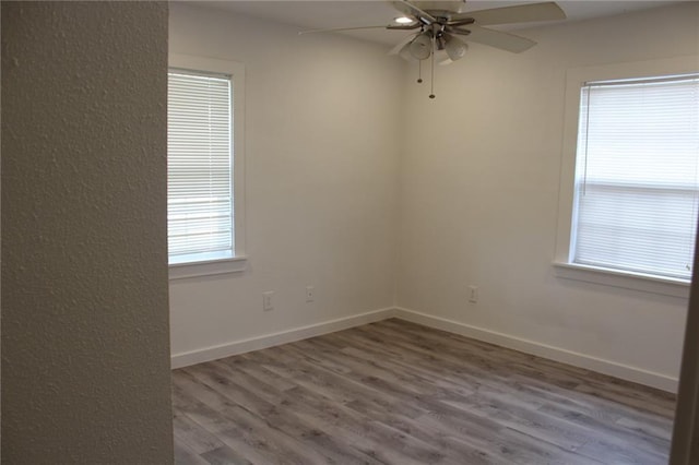 3024 Hero Dr, Gretna, LA 70053 - unfurnished room with wood finished floors, a ceiling fan, and baseboards