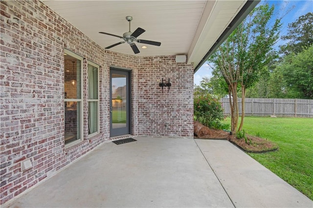 view of patio / terrace with a ceiling fan and fence