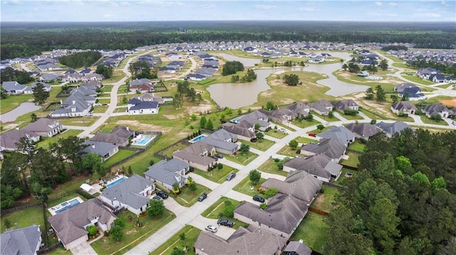birds eye view of property featuring a residential view and a water view