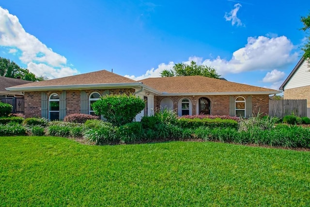 5 N Lafourche Ct, Kenner, LA 70065 - ranch-style house featuring fence, brick siding, and a front lawn