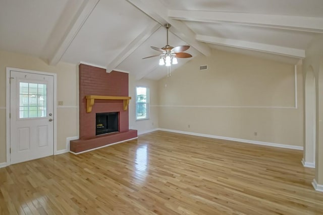 5 N Lafourche Ct, Kenner, LA 70065 - unfurnished living room featuring vaulted ceiling with beams, light wood-style floors, a fireplace, baseboards, and a ceiling fan
