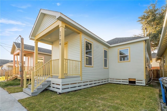 1704 Desire St, New Orleans, LA 70117 - view of side of property featuring covered porch and roof with shingles