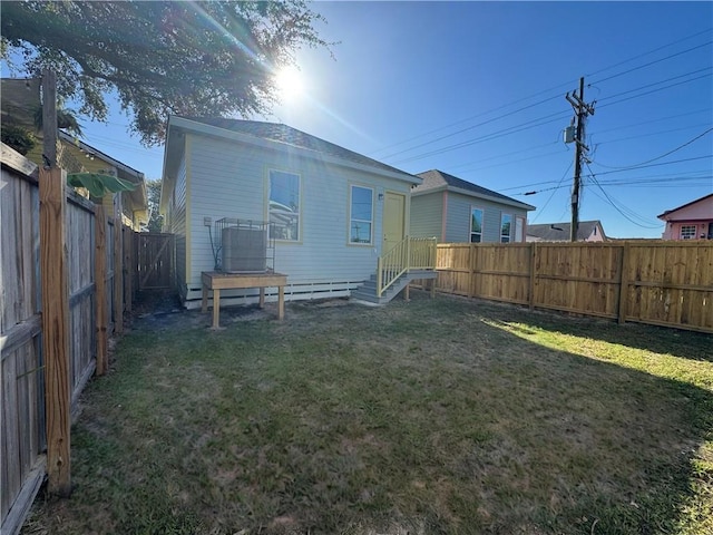 1704 Desire St, New Orleans, LA 70117 - back of house featuring central AC unit