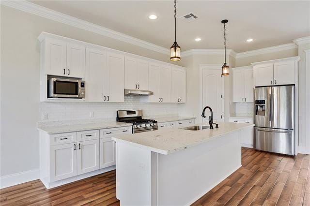 2832 Pirate Dr, Chalmette, LA 70043 - kitchen with stainless steel appliances, white cabinets, dark wood-style flooring, ornamental molding, and recessed lighting