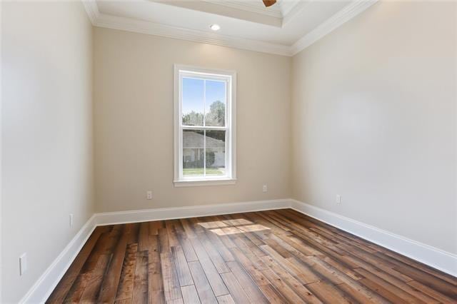 spare room featuring crown molding, recessed lighting, baseboards, and wood-type flooring