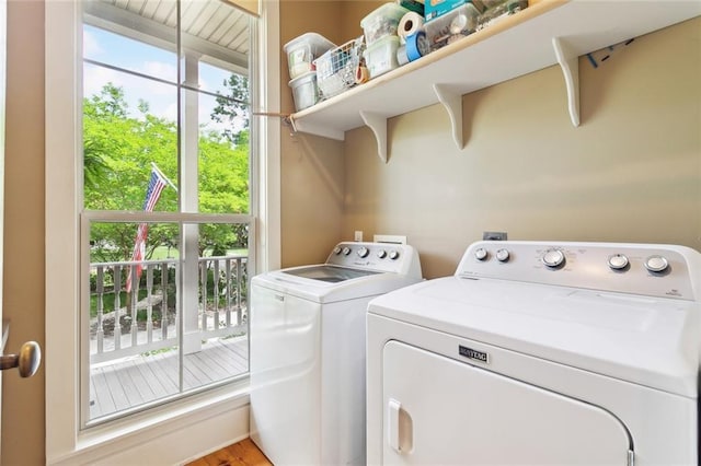 washroom with separate washer and dryer and laundry area