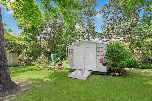 view of shed with fence