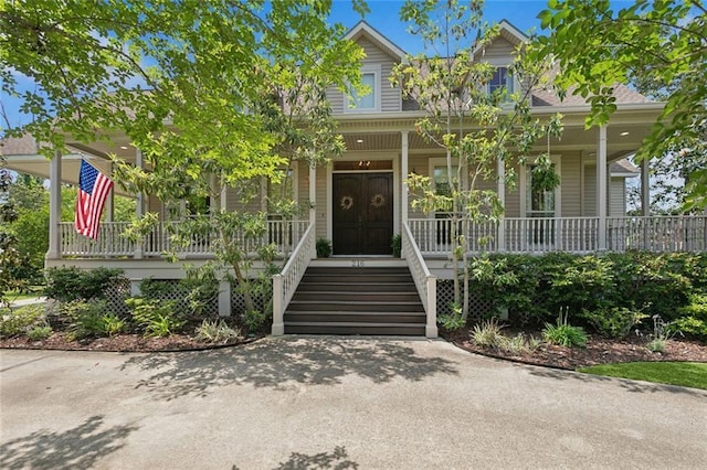 entrance to property with covered porch
