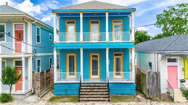 1379 Saint Anthony St, New Orleans, LA 70116 - rear view of house with a porch, fence, and a balcony