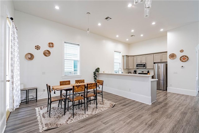 1379 Saint Anthony St, New Orleans, LA 70116 - dining area with recessed lighting, baseboards, light wood finished floors, and visible vents