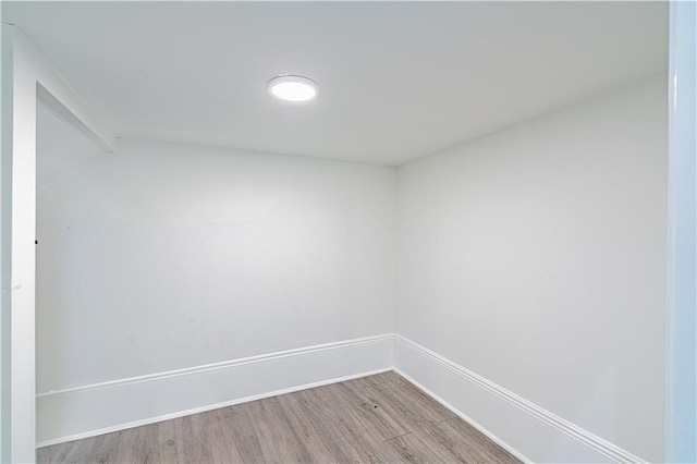 1379 Saint Anthony St, New Orleans, LA 70116 - spare room featuring baseboards, vaulted ceiling, and wood finished floors
